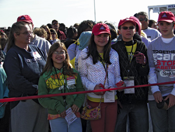 Madi, a teen ambassador for the American Diabetes Association’s Walk for Diabetes, cuts the ribbon to start the event.