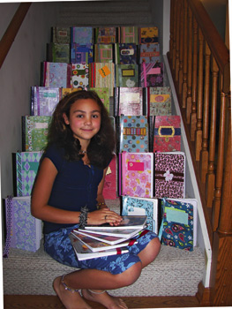 Madi and her “All That Jazz” journals, which she crafts and sells to raise money for research.