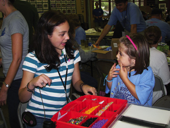 Madi volunteers as “the Bead Princess,” awarding beads to children for completing activities at the Sugar-free Weekend Retreat in 2009.