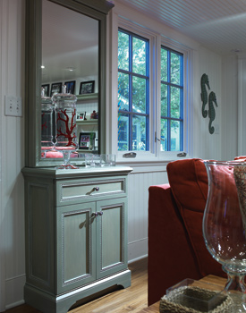 Ceilings and walls are clad in bead board to make the ceilings appear higher. Copyright Don Pearse Photographers Inc.